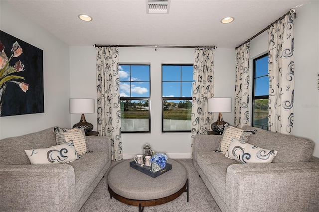 13722 Heartwood Way, Parrish, FL 34219 - carpeted living room with recessed lighting, baseboards, and a textured ceiling