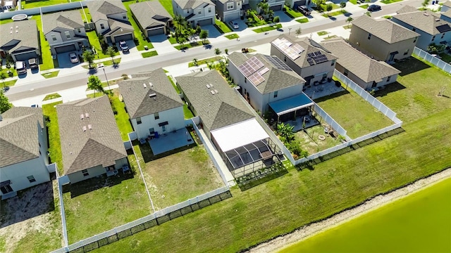 aerial perspective of suburban area featuring a nearby body of water