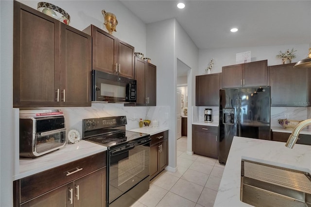 kitchen featuring black appliances, backsplash, dark brown cabinets, light tile patterned flooring, and recessed lighting