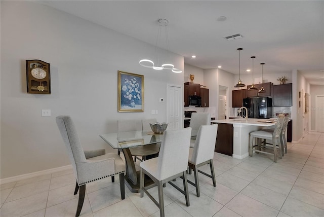dining area with light tile patterned flooring, recessed lighting, and baseboards