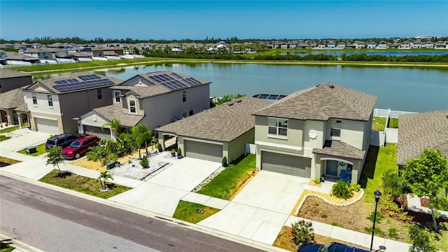 aerial perspective of suburban area with a nearby body of water