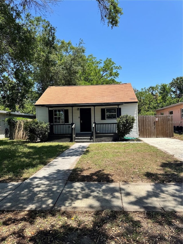 1675 13th Ave S, Saint Petersburg, FL 33712 - view of front of house featuring a porch and a shingled roof