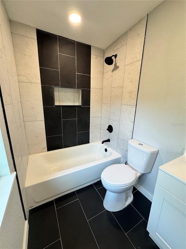 1675 13th Ave S, Saint Petersburg, FL 33712 - bathroom featuring toilet, tile patterned flooring, washtub / shower combination, and vanity
