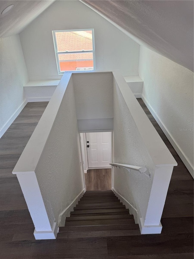 1675 13th Ave S, Saint Petersburg, FL 33712 - stairs with wood finished floors, a textured wall, lofted ceiling, and baseboards