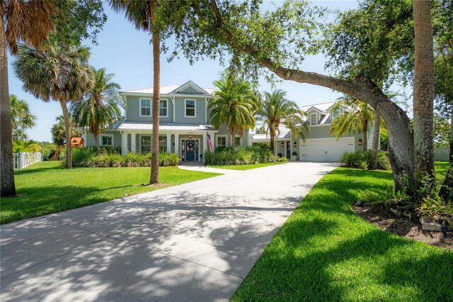 8927 Key W Island Way, Riverview, FL 33578 - view of front facade with driveway, a front lawn, and a porch