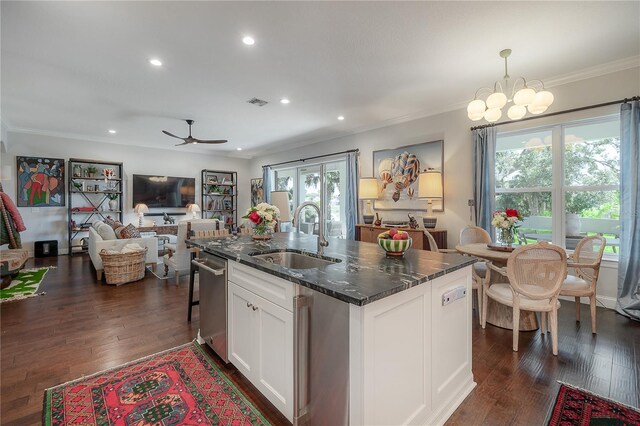 8927 Key W Island Way, Riverview, FL 33578 - kitchen with a sink, crown molding, open floor plan, white cabinets, and stainless steel dishwasher