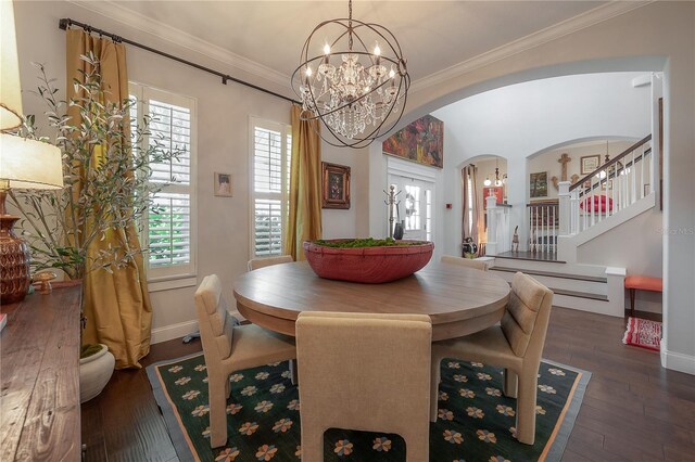 8927 Key W Island Way, Riverview, FL 33578 - dining room featuring arched walkways, a chandelier, wood-type flooring, ornamental molding, and baseboards