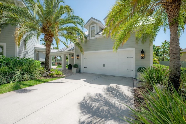 8927 Key W Island Way, Riverview, FL 33578 - view of front of house with concrete driveway and a garage