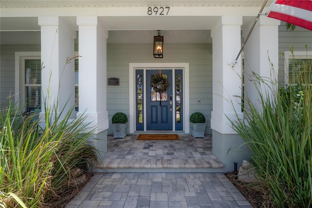 8927 Key W Island Way, Riverview, FL 33578 - doorway to property with covered porch