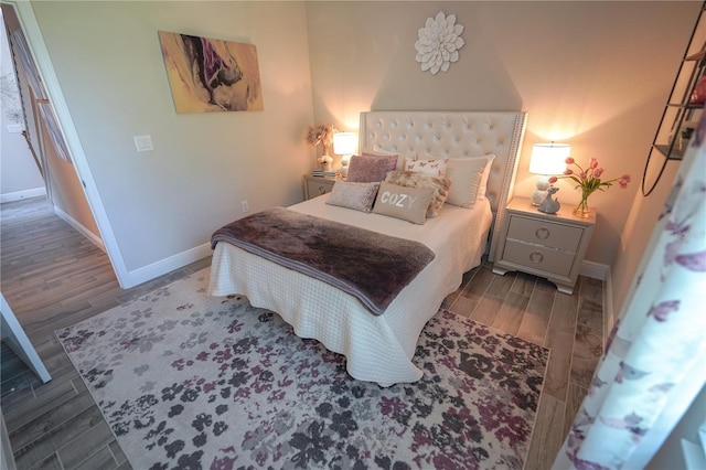 13103 Monach Isles Dr, Riverview, FL 33579 - bedroom with baseboards and wood finished floors