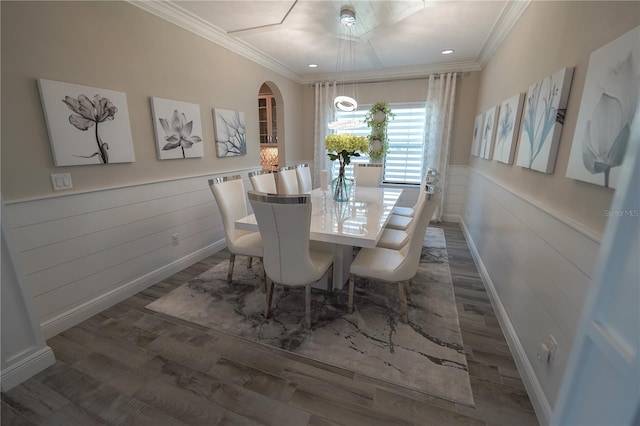 13103 Monach Isles Dr, Riverview, FL 33579 - dining area featuring wood finished floors, wainscoting, crown molding, arched walkways, and recessed lighting