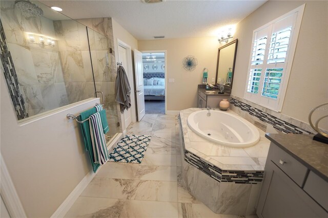 13103 Monach Isles Dr, Riverview, FL 33579 - ensuite bathroom featuring a whirlpool tub, tiled shower, vanity, marble finish flooring, and baseboards