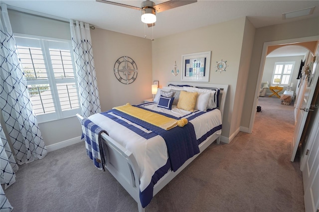 13103 Monach Isles Dr, Riverview, FL 33579 - carpeted bedroom featuring baseboards, arched walkways, and ceiling fan