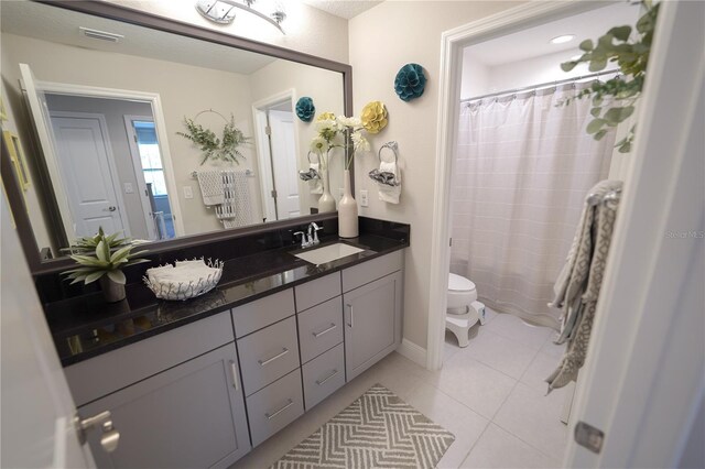 13103 Monach Isles Dr, Riverview, FL 33579 - full bathroom featuring toilet, vanity, tile patterned floors, and curtained shower