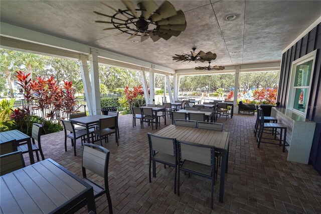 13103 Monach Isles Dr, Riverview, FL 33579 - view of patio with outdoor dining area, ceiling fan, and fence