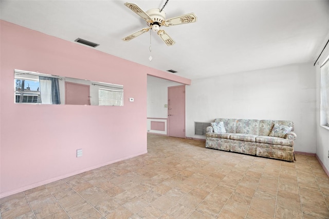 3348 Clydesdale Dr, Holiday, FL 34691 - living area featuring ceiling fan and baseboards