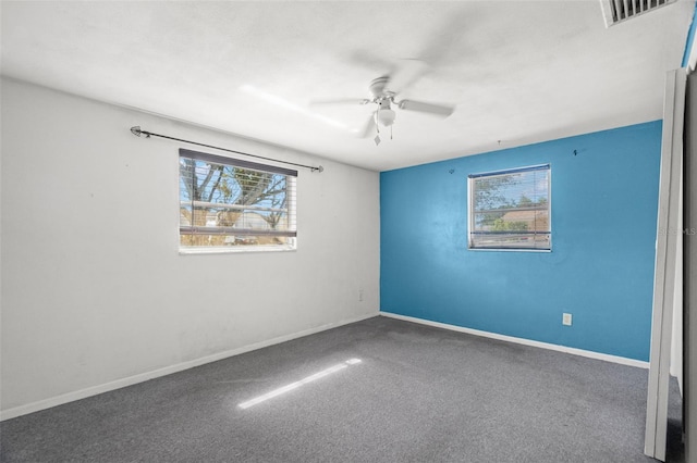 3348 Clydesdale Dr, Holiday, FL 34691 - empty room featuring a ceiling fan, baseboards, and carpet flooring