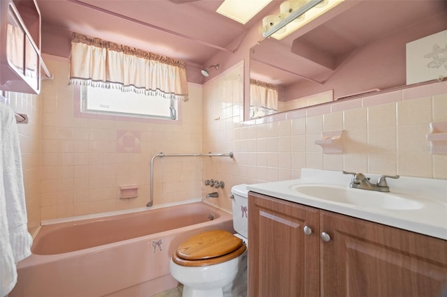 3348 Clydesdale Dr, Holiday, FL 34691 - full bathroom with toilet,  shower combination, tile walls, vanity, and decorative backsplash