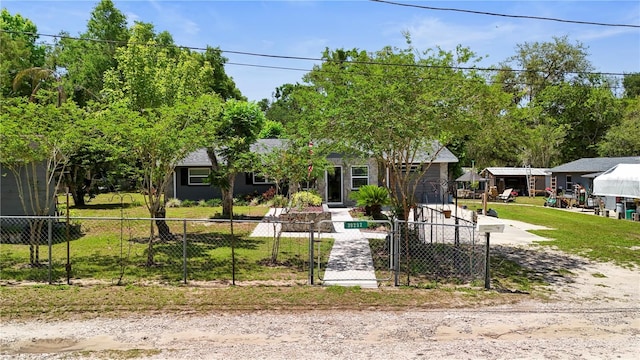 obstructed view of property with a fenced front yard