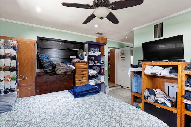 bedroom featuring ornamental molding, tile patterned flooring, and a ceiling fan