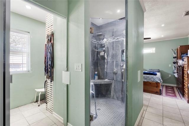 ensuite bathroom with a shower stall, plenty of natural light, tile patterned flooring, and recessed lighting