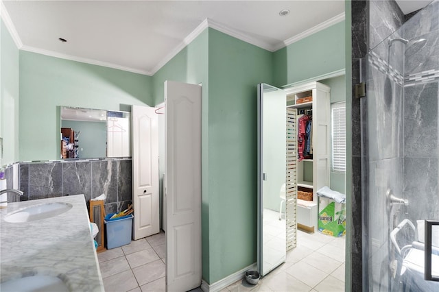 full bath with tile patterned floors, ornamental molding, vanity, a shower, and a spacious closet
