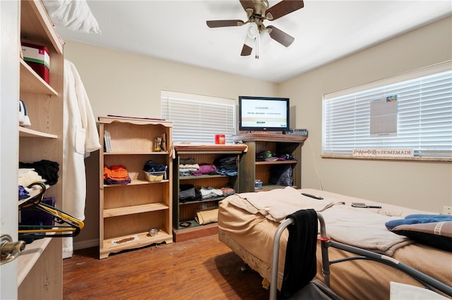 bedroom featuring wood finished floors and ceiling fan