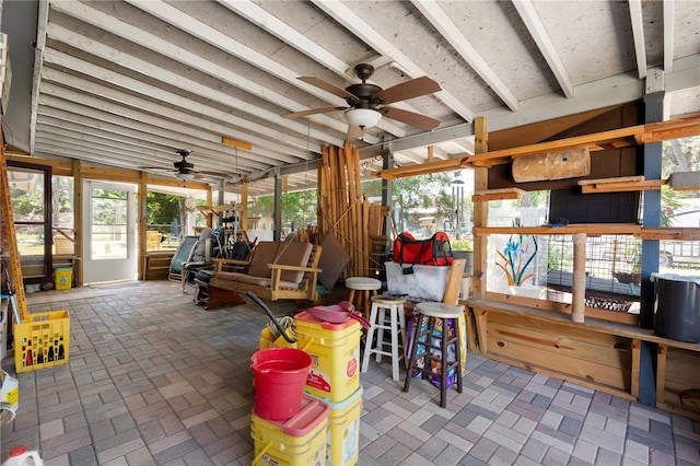 sunroom / solarium featuring ceiling fan