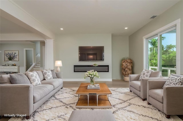 3752 Arkansas Ave NE, Saint Petersburg, FL 33703 - living area featuring recessed lighting, light wood finished floors, baseboards, and stairway