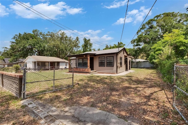1920 E Chelsea St, Tampa, FL 33610 - back of property featuring a gate
