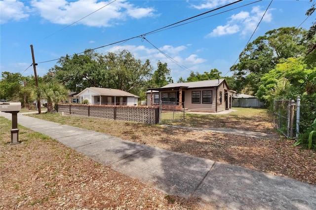 1920 E Chelsea St, Tampa, FL 33610 - view of front of house featuring a fenced front yard