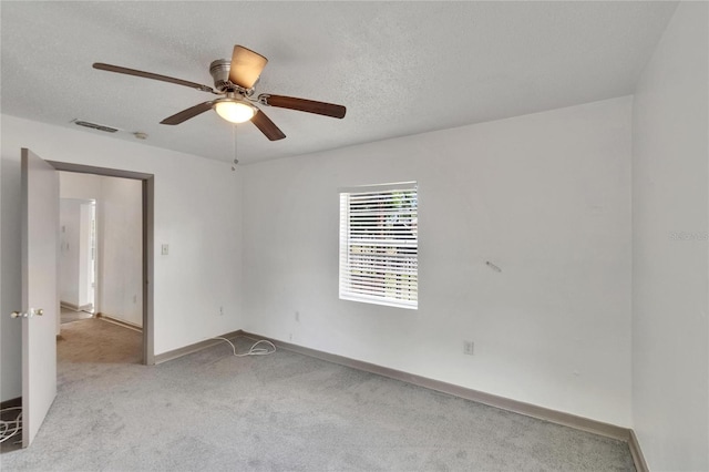 1920 E Chelsea St, Tampa, FL 33610 - unfurnished room featuring carpet flooring, ceiling fan, baseboards, and a textured ceiling