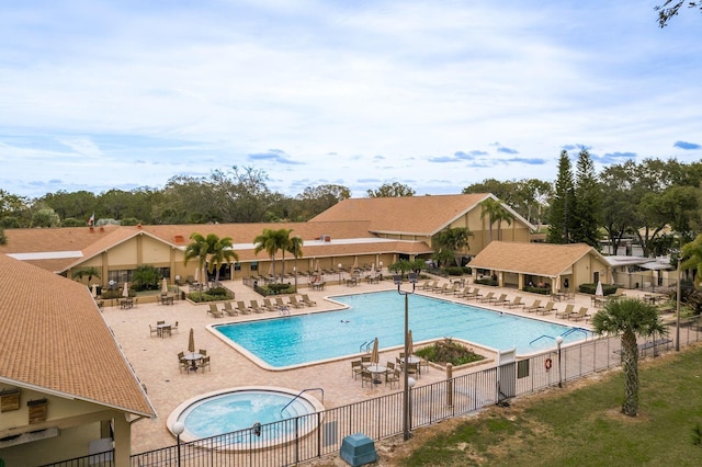 1065 Tartan Dr Unit C, Palm Harbor, FL 34684 - community pool with a patio and a hot tub