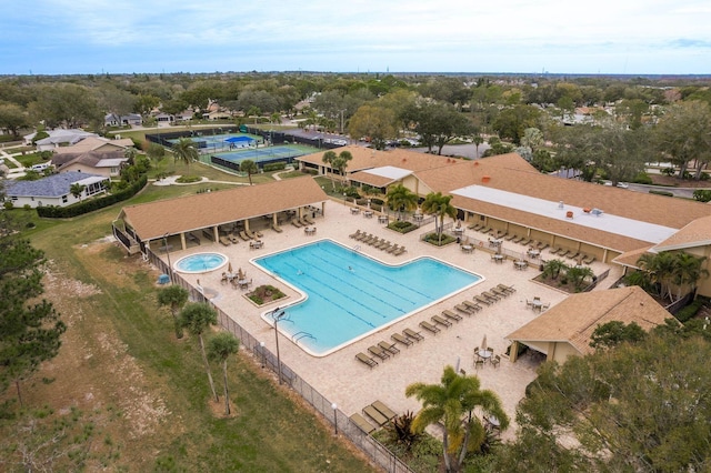 1065 Tartan Dr Unit C, Palm Harbor, FL 34684 - bird's eye view of a pool area and a tree filled landscape