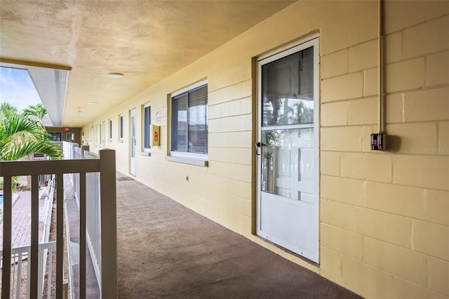 600 71st Ave Unit 18, St Pete Beach, FL 33706 - doorway to property featuring a balcony