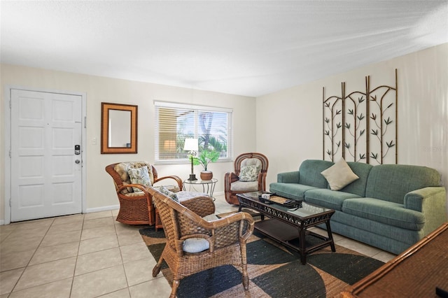 600 71st Ave Unit 18, St Pete Beach, FL 33706 - living room with light tile patterned floors and baseboards
