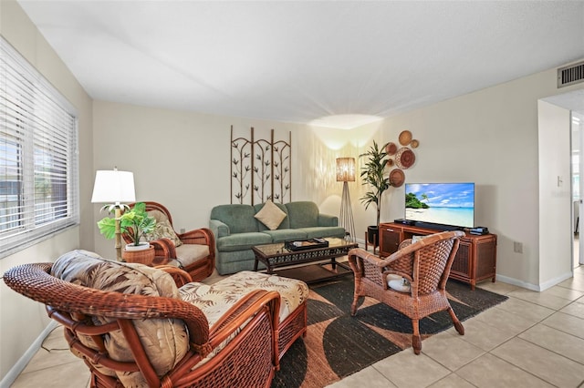 600 71st Ave Unit 18, St Pete Beach, FL 33706 - living area featuring light tile patterned floors and baseboards