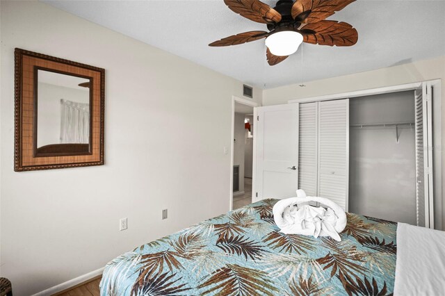 600 71st Ave Unit 18, St Pete Beach, FL 33706 - bedroom featuring a closet, baseboards, a ceiling fan, and wood finished floors