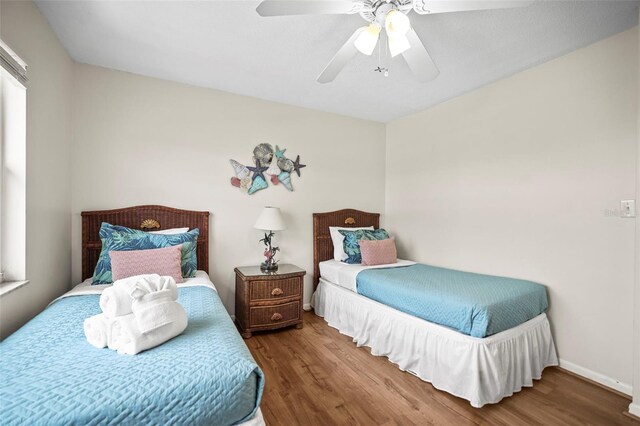600 71st Ave Unit 18, St Pete Beach, FL 33706 - bedroom featuring wood finished floors and ceiling fan