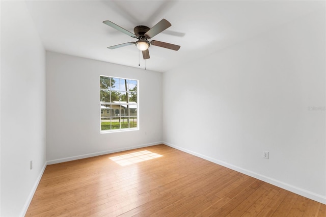 2313 Palm Ave, Seffner, FL 33584 - unfurnished room with light wood-style floors, baseboards, and a ceiling fan