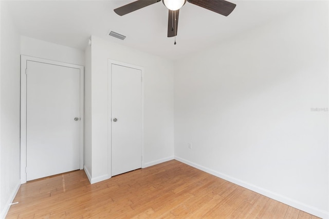 2313 Palm Ave, Seffner, FL 33584 - unfurnished bedroom with light wood-style floors, ceiling fan, and a closet