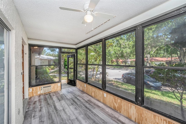 2770 Keats Ter Unit C, Palm Harbor, FL 34684 - unfurnished sunroom featuring a wall mounted AC and a ceiling fan