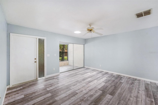2770 Keats Ter Unit C, Palm Harbor, FL 34684 - empty room featuring a ceiling fan, wood finished floors, and baseboards