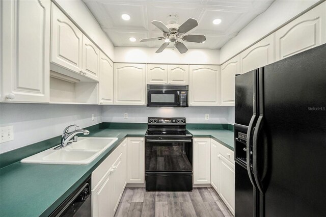 2770 Keats Ter Unit C, Palm Harbor, FL 34684 - kitchen featuring black appliances, a sink, light wood-style flooring, recessed lighting, and a ceiling fan
