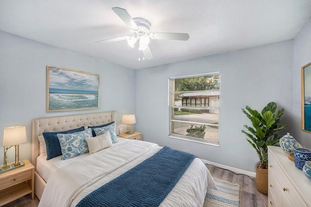 2770 Keats Ter Unit C, Palm Harbor, FL 34684 - bedroom featuring wood finished floors, a ceiling fan, and baseboards