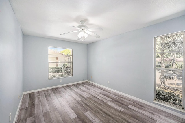 2770 Keats Ter Unit C, Palm Harbor, FL 34684 - spare room featuring healthy amount of natural light, ceiling fan, and wood finished floors