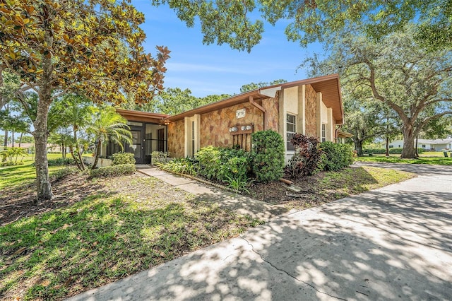 2770 Keats Ter Unit C, Palm Harbor, FL 34684 - view of front of property featuring stucco siding and stone siding
