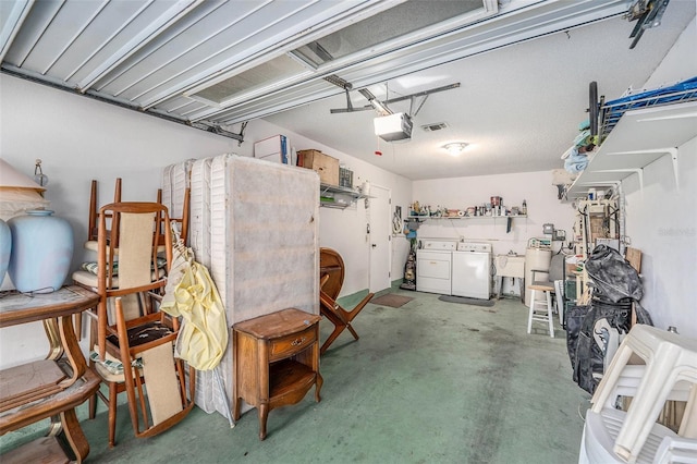 2770 Keats Ter Unit C, Palm Harbor, FL 34684 - garage featuring independent washer and dryer, a garage door opener, and a sink