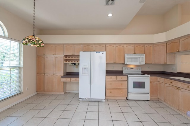 1126 Haley Ln, Dunedin, FL 34698 - kitchen with white appliances, light brown cabinetry, dark countertops, pendant lighting, and recessed lighting
