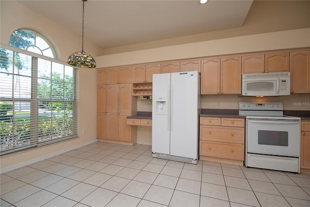 1126 Haley Ln, Dunedin, FL 34698 - kitchen featuring white appliances, light brown cabinets, dark countertops, light tile patterned flooring, and hanging light fixtures